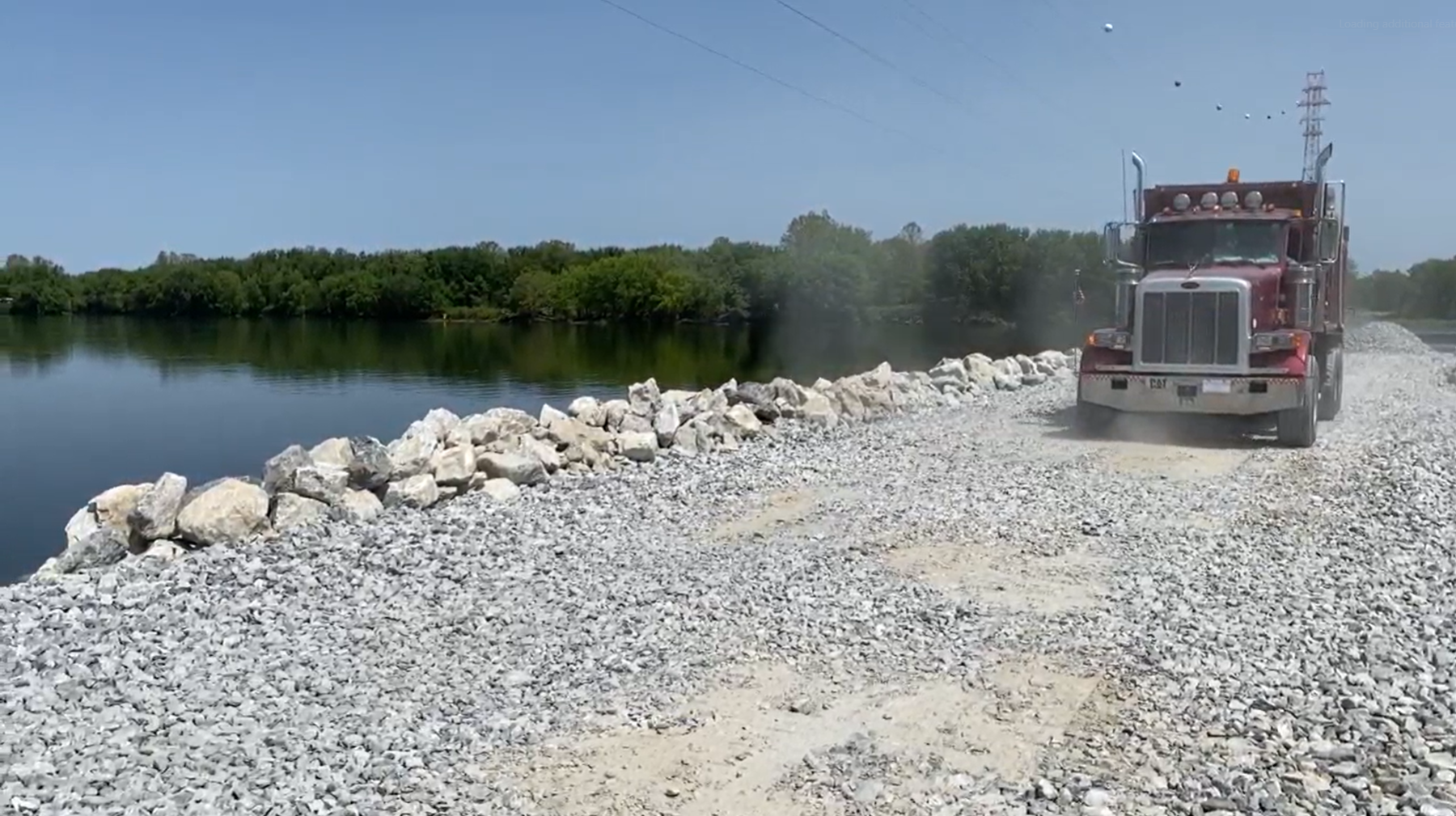 PPL Electric Utilities - Stone Causeway Construction B-Roll - Dump Truck and River (7 Seconds)