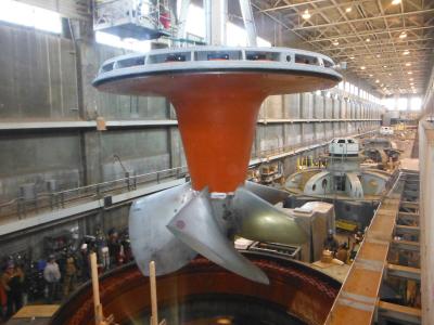 A new, state-of-the-art turbine is lowered into place during the modernization effort at the Ohio Falls hydro station.