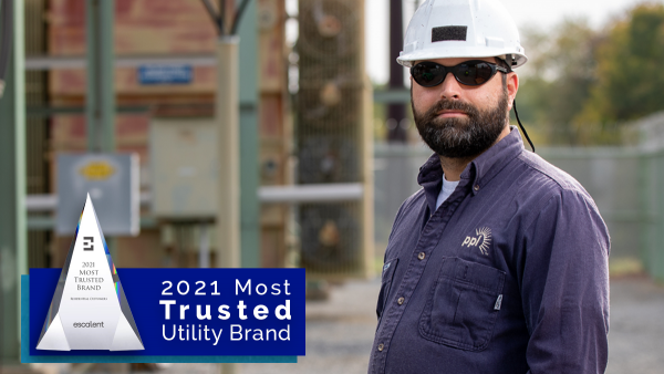 PPL Electric Utilities named among most trusted utility brands in the nation - PPL employee standing at work site in a hard hat and protective equipment